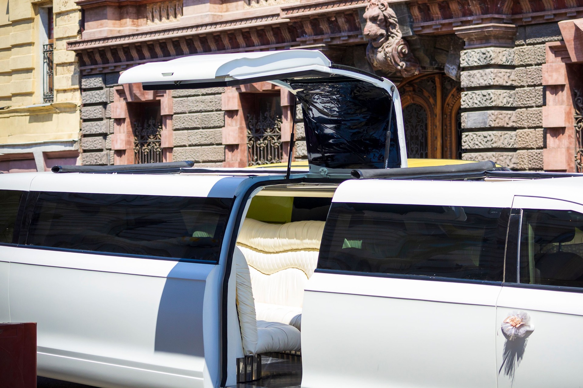 White limousine door open with light leather interior